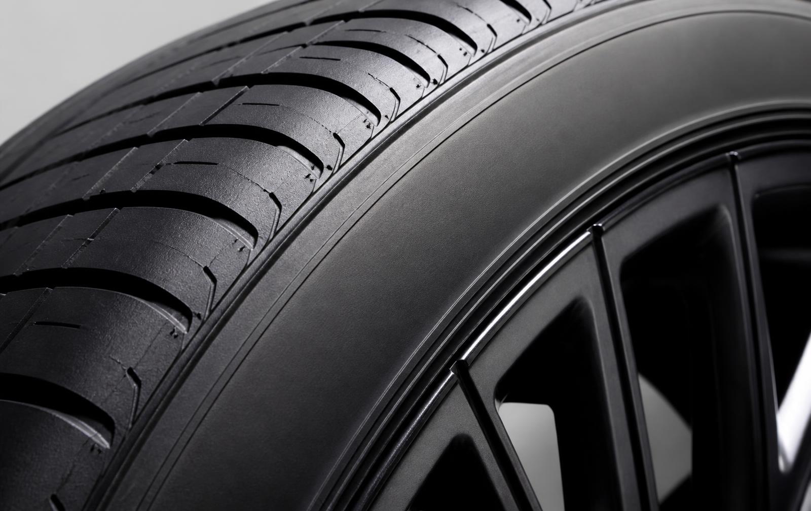 Close-up of an EV tire sidewall showing tire specification markings